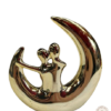 deco figuras adornos enamorados ceramico plateado y dorado